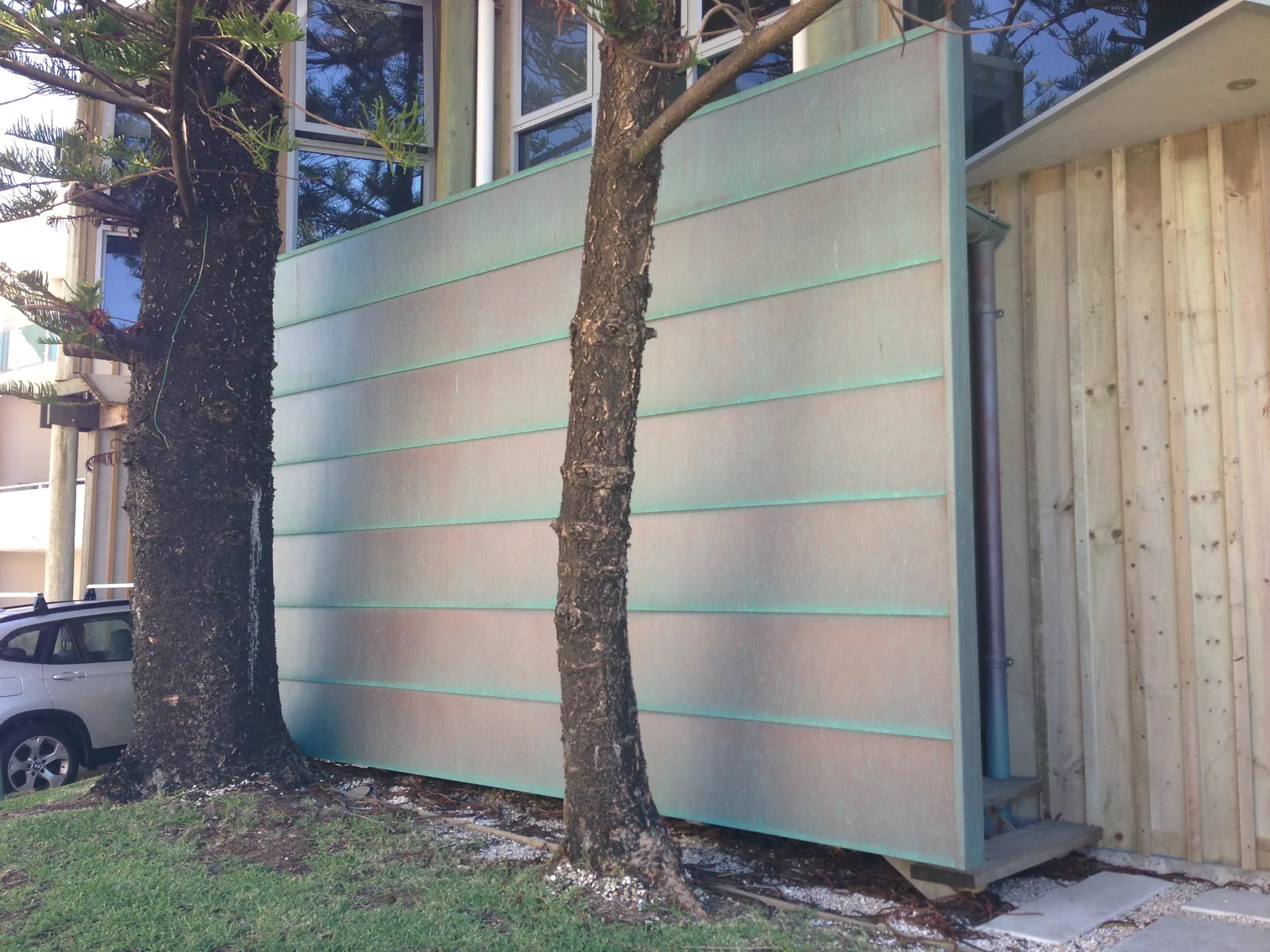 Pre-patinated green copper flat-lock feature wall by Euroclad